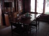 Dark wooden desk by window