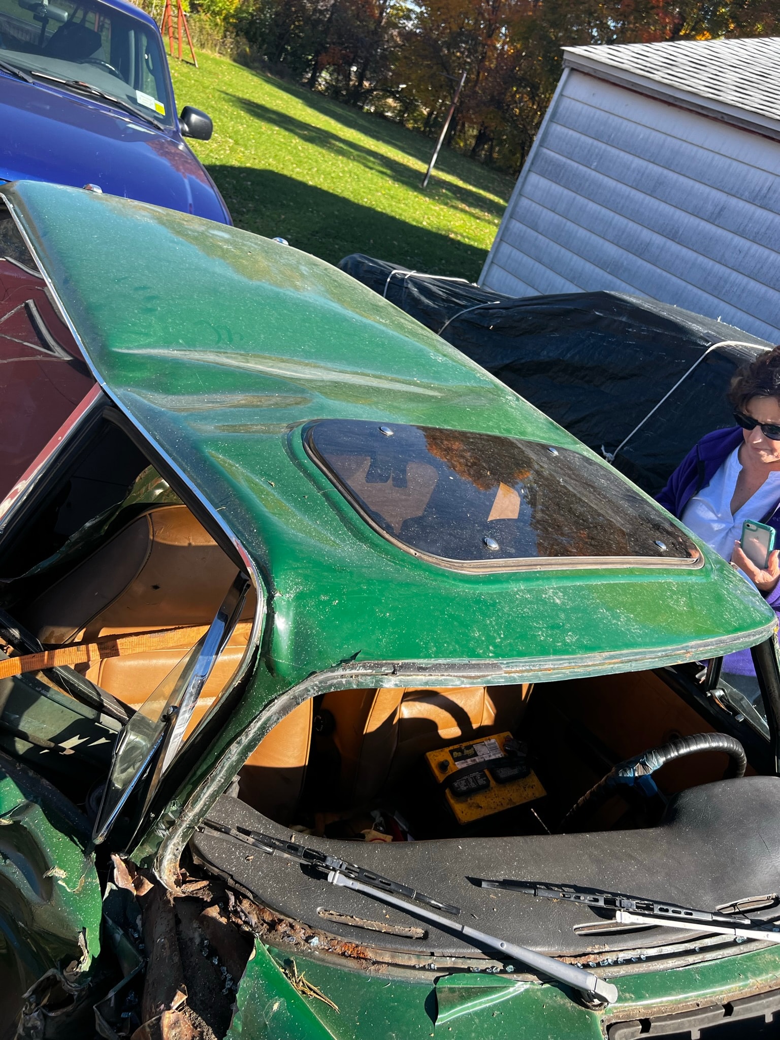 Vintage green convertible with rust patina