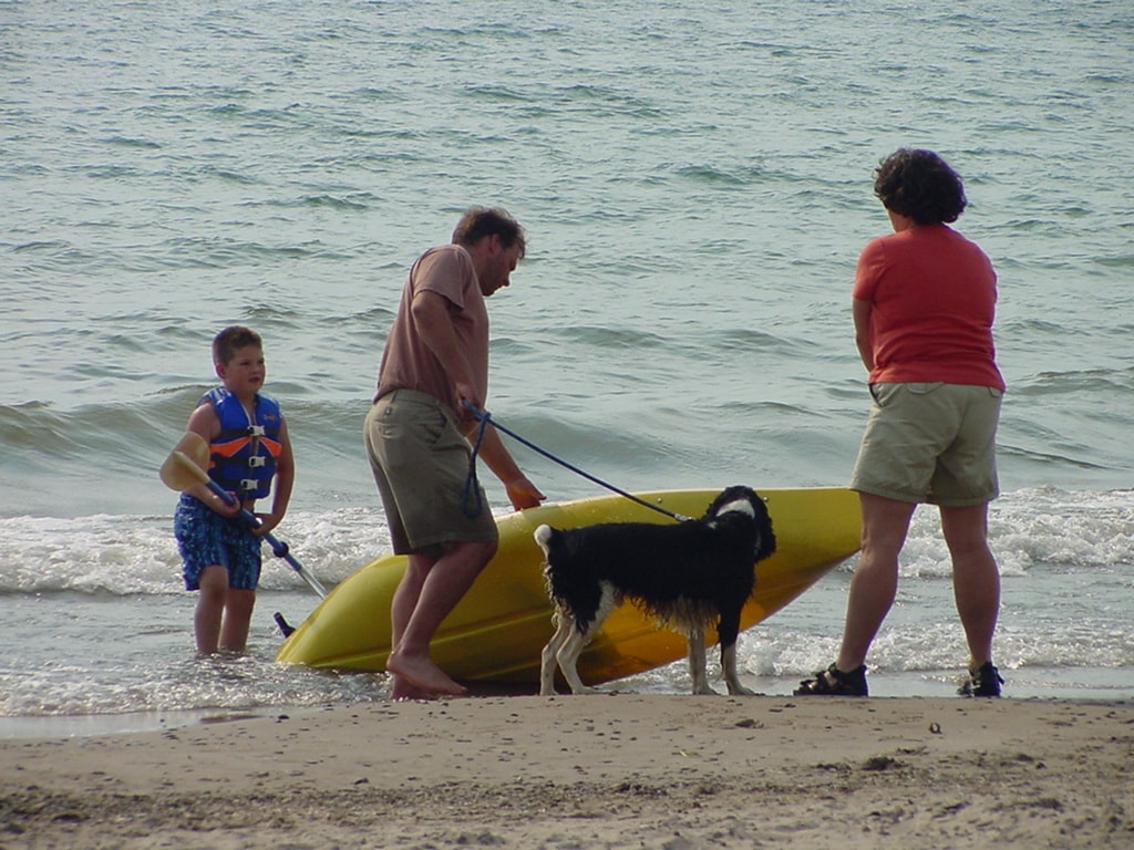 Family with dog at the beach